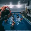 people stretching inside pool room